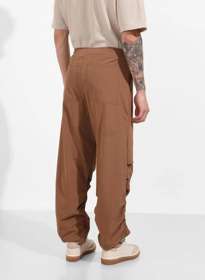The Indian Garage Co  Men Baggy Fit Solid Cross Pocket Mid-Rise Trousers for Men | Best Price UAE
